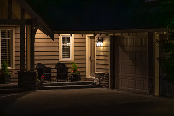 Entrance of luxury house with nice spring blossom landscape at night in Vancouver, Canada, North...