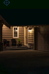 Entrance of luxury house with nice spring blossom landscape at night in Vancouver, Canada, North...
