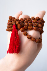  Japamala on the hand. Prayer beads. Religious equipment
