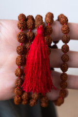  Japamala on the hand. Prayer beads. Religious equipment