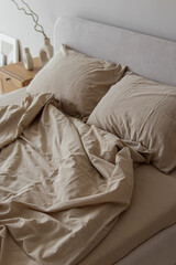Beige bed linen made of boiled cotton. Soft focus