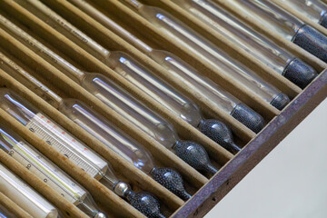 old laboratory thermometers and other tools used long ago in the laboratory