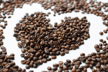 Perfectly roasted coffee beans on a white background. Coffee.