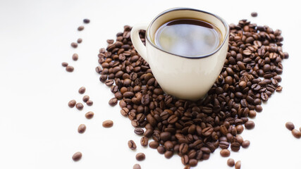Coffee cup and coffee beans on a white background. A coffee house.