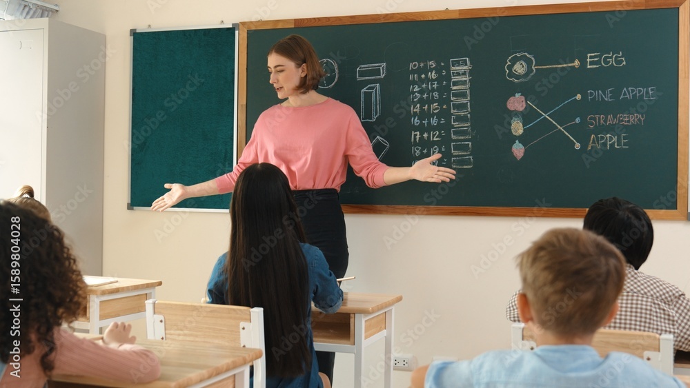 Poster smart teacher checking cute student homework while explaining idea at class. attractive instructor w