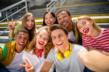 Diverse group of friends enjoying outdoor time together excited and bonding on a sunny day