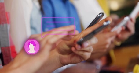 Coworkers typing smartphones at café receiving pink chat icon shifting bubble swiping for messaging - Powered by Adobe