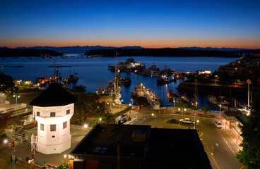 Nanaimo Harbor Dawn British Columbia Canada. The historic Bastion guardhouse overlooks the harbor and marina at dawn in downtown Nanaimo, British Columbia, Canada. 

