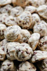 Freshly baked chocolate chip cookies piled high ready for enjoyment at a cozy gathering
