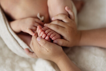 baby feet in brother's hands, newborn ..love
