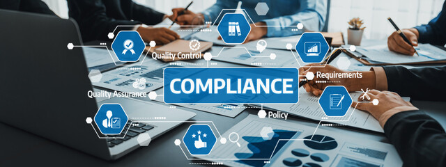 A collaborative business meeting focused on compliance, featuring discussions around quality...