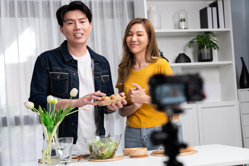 Cooking show on live streaming with two chef influencers presenting wholegrain bun bread side dish...