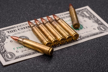 Money, cash dollars to fund weapons for war and defense against attack. Dollars for war
