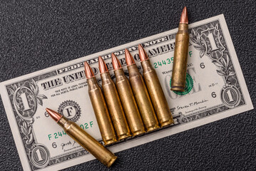 Money, cash dollars to fund weapons for war and defense against attack. Dollars for war