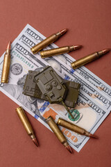 Money, cash dollars to fund weapons for war and defense against attack. Dollars for war