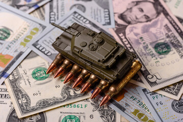 Money, cash dollars to fund weapons for war and defense against attack. Dollars for war
