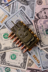 Money, cash dollars to fund weapons for war and defense against attack. Dollars for war
