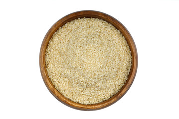 Top view closeup of freshly harvested white sesame in wooden bowl isolated on white background with clipping path.