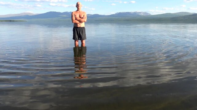 Klocka, Sweden A man bathes in the remote &Aring;nnsj&ouml;n Lake in the J&auml;mtland region.  