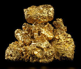 Pile of gold nuggets isolated on a black background. Gold ore.