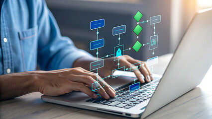 A person is typing on a laptop, interacting with a digital workflow diagram, representing business process automation and digital transformation