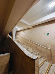 Staircase leading to lower level in a public building at midday