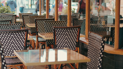 Cozy city cafe with vintage furniture, small tables and inviting street style.