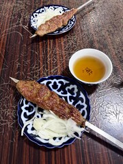 meat kebab on the plate and tea