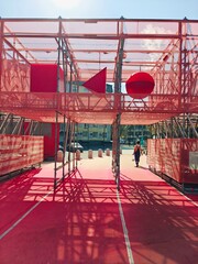 Colorful geometric installation invites interaction in urban setting on a bright sunny day
