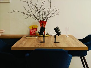 Stylish dining table with decorative elements and modern lights in a cozy interior setting