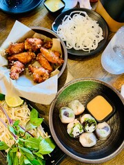 A Vietnamese feast for the senses!  Crispy wings, fresh summer rolls, and all the fixings.