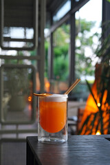 Tequila sunrise cocktail in a restaurant setting