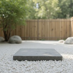 Product presentation template. A square gray stone in a gravel garden area.