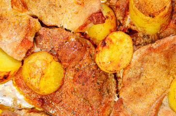 Baked pork and potato meal in oven seen as unhealthy greasy food