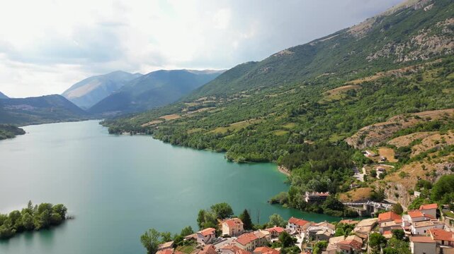 Italy, July 3, 2025: Panoramic aerial view from the drone of the village of Barrea located in a mountainous area pertaining to the Alto Sangro basin and Lake Barrea in the province of L'Aquila