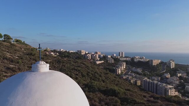  Aerial view moving around the cross of Stella Maris chapel monastery ,Haifa,video footage (circle mode)