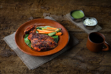 Delicious Grilled Chicken Served with Vegetables and Dipping Sauces