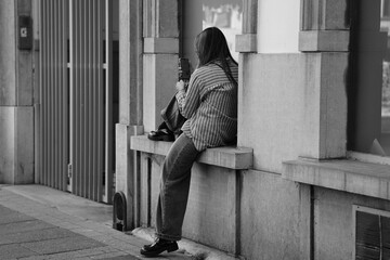 women sitting in the city