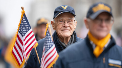 Veterans marching in parade carrying american flags and banners on veterans day