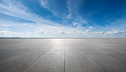 empty concrete expanse under serene blue sky