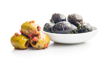Tapas. Flavored pickled olives isolated on white background.