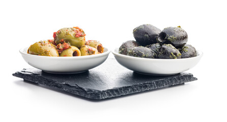 Tapas. Flavored pickled olives in bowl isolated on white background.