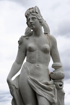 Vertical close up of an ornate white marble statue of Asia, the Oceanid from Greek mythology