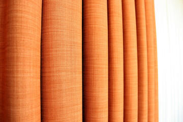 orange curtain with soft folds