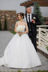 Elegant outdoor wedding ceremony capturing the couple in formal attire with floral bouquet