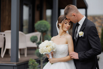 Elegant couple celebrating wedding outdoors in a beautiful setting during daylight