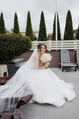 Bridal portrait in outdoor setting on a cloudy day at a modern venue