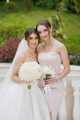 Bridal celebration with friends in lush garden on a sunny day