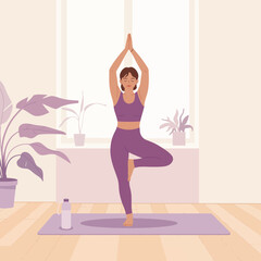 Obraz premium Woman practicing yoga tree pose on mat in a bright room with plants