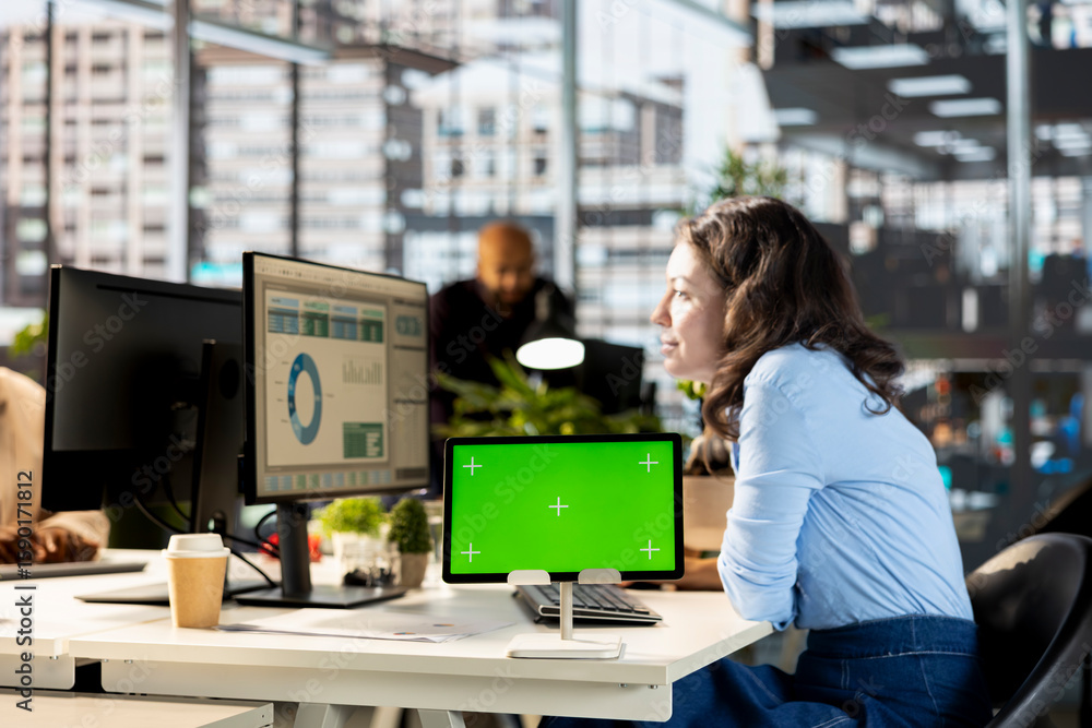 Aufkleber young manager works with infographics next to isolated display at the desk, working on enterprise so